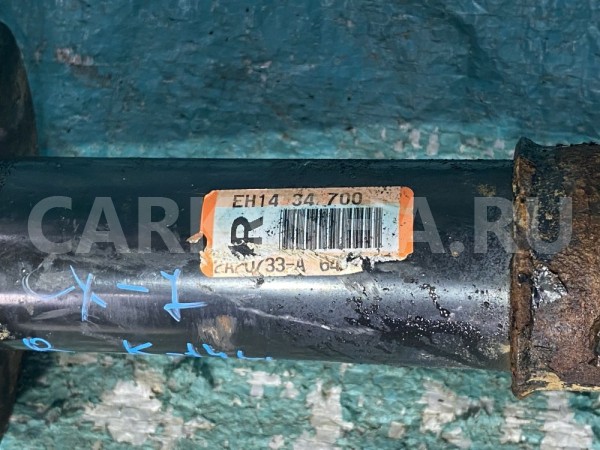 Амортизатор передний правый Mazda CX-7 I Mazda 2 оригинальный номер EH1434700